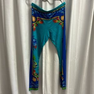 95% viscose 5% spandex leggings with ocean print and rhinestone accent at ankle